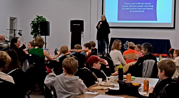 Parents, carers and students gather at Fair Play Kitchen as Rebecca Sparrow presents practical friendship advice during the Christ the King School seminar.