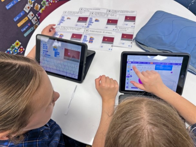 Two students use Scratch as part of the CTK School STEM Day activities.